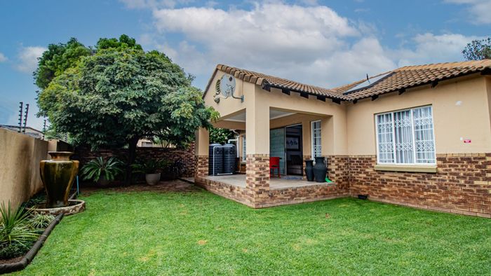 Moreleta Park Townhouse For Sale: Open-plan living, double garages, eco-friendly features.