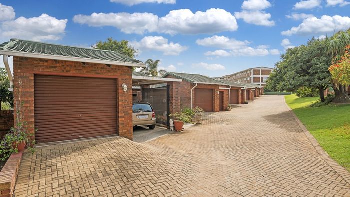 For Sale: Townhouse in Rembrandt Park with modern kitchen, entertainment patio, and private garden