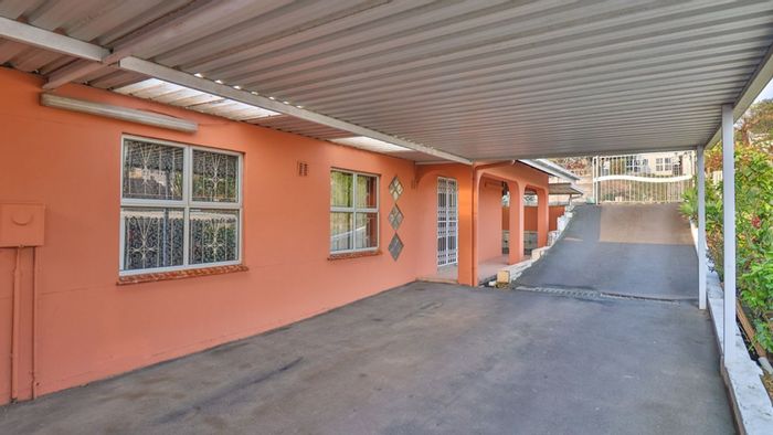 Bonela House For Sale: Four bedrooms, gourmet kitchen, garage, and entertainment area.