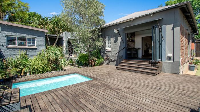 Melville House For Sale: Income potential, entertainer's deck, pool, and off-street parking.