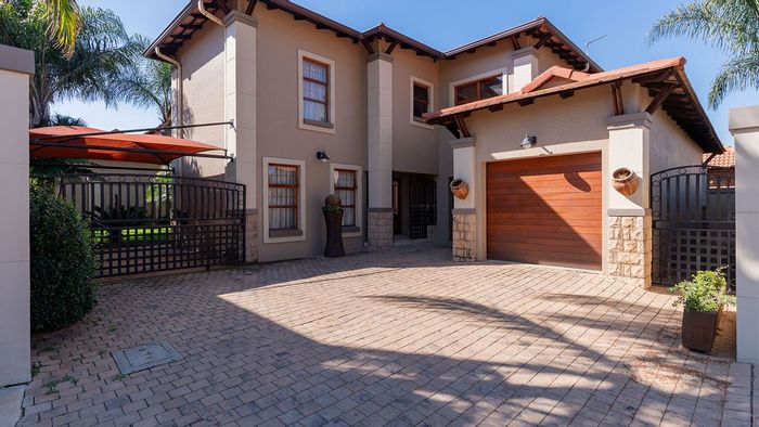 For Sale: House in Bartlett with large yard, double garage, and secured complex.