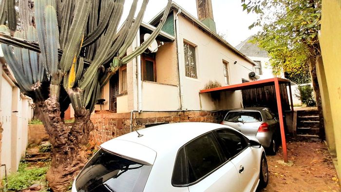 For Sale: House in Bezuidenhout Valley with pool, parking, and spacious living areas.
