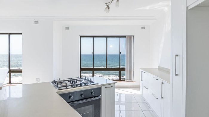 Amanzimtoti Central Apartment For Sale: Renovated, sea views, garage, communal amenities.