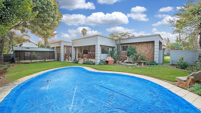 Alphen Park House For Sale: Spacious layout, pool, garden, and entertainment area.