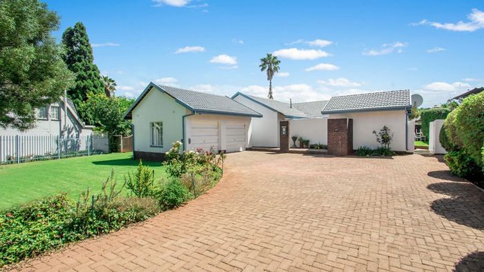 For Sale: Spacious Roodekrans house with garden, borehole, and double garage.