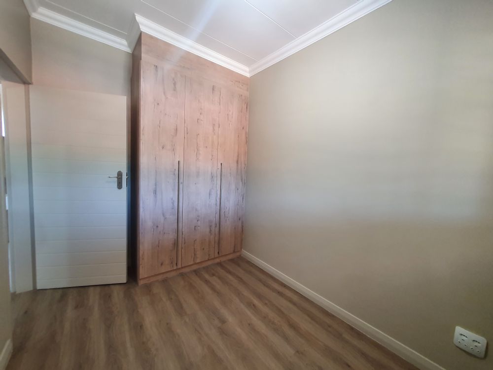 2nd Bedroom with built-in cupboards.