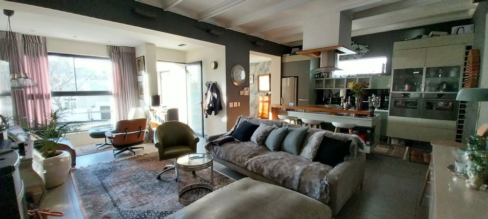 open plan lounge, reading nook and kitchen