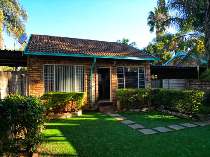 To Rent: Apartment in The Orchards with private garden and security features.