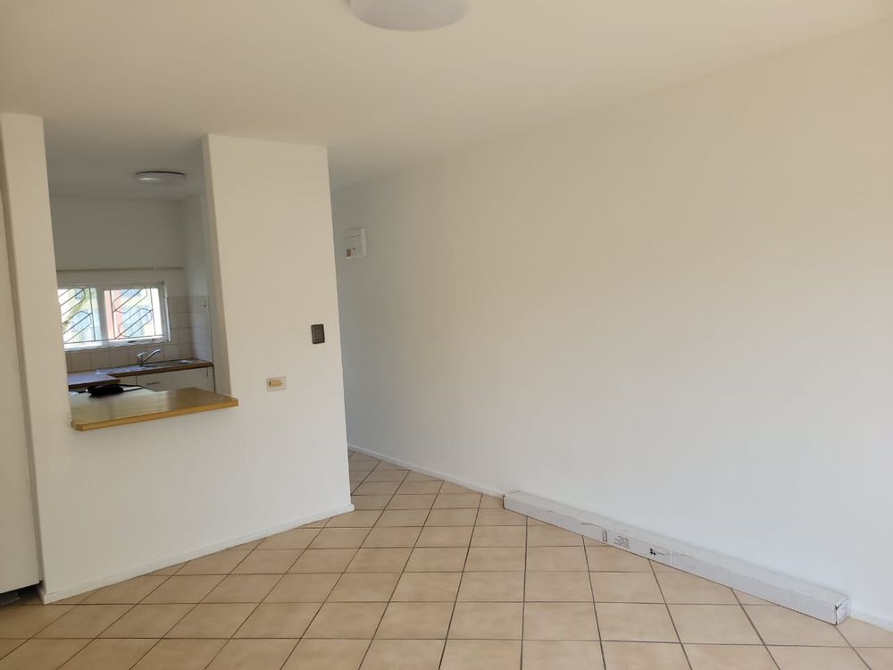 Living area with view of kitchen area