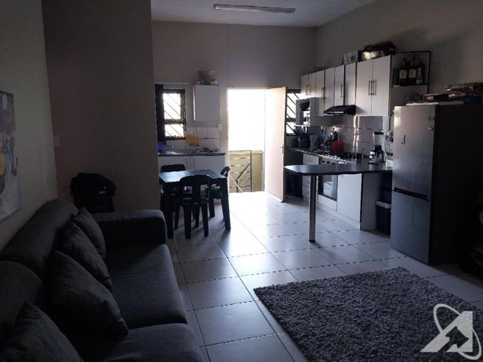 2-bedroom flat for sale in Otjomuise with open plan living and parking.