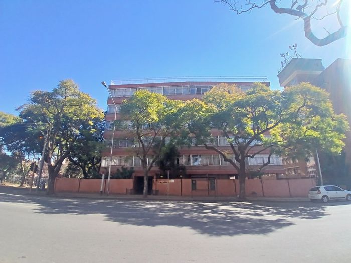 2-Bedroom Apartment For Sale in Sunnyside with rental potential and convenient amenities.