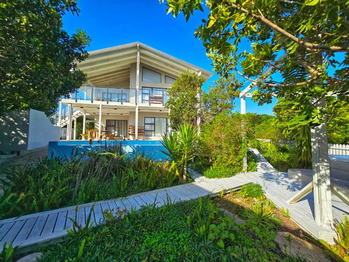 For Sale: Kingfisher Creek House with ocean views, pool, and guest cottage.