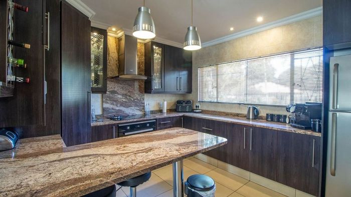 For Sale: Spacious 4-Bedroom House in Van Riebeeck Park with Pool and Garages.