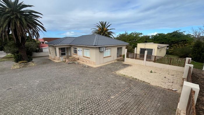 Commercial office for sale in Jeffreys Bay Central with security, parking, and power backup.