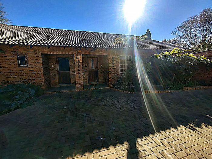 Derdepoort House For Sale: Two homes, flatlet, large yard, rental income potential.