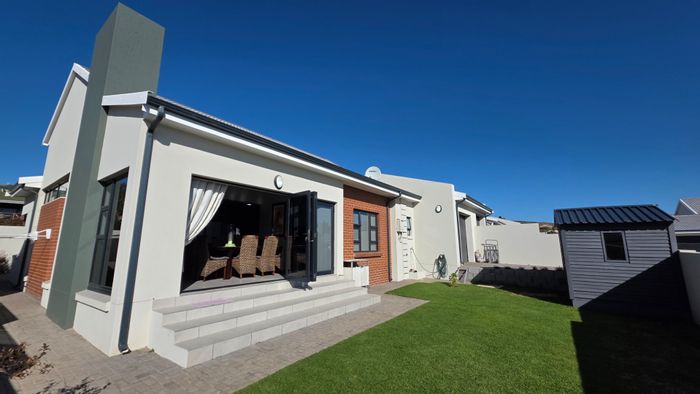 For Sale: House in Hartenbos Heuwels with open plan living, garage, and garden.