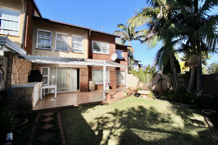 For Sale: Highway Gardens Townhouse with pool, clubhouse, and double garage.