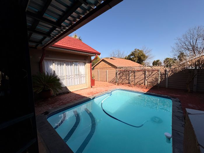 For Sale: Spacious 4-bedroom house in Wilkoppies with pool, garages, and garden.