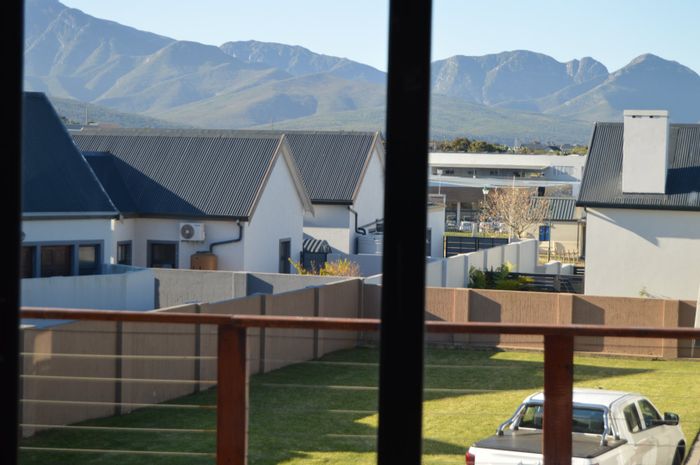 For Sale: House in Blue Mountain Village with solar power, garden, and spacious layout.