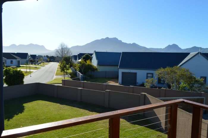 House for Sale in Blue Mountain Village: 4 bedrooms, eco-friendly features, indoor braai.