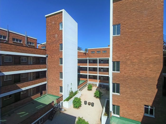Illovo Apartment For Sale: Renovation-ready studio with balcony, parking, and solar power.