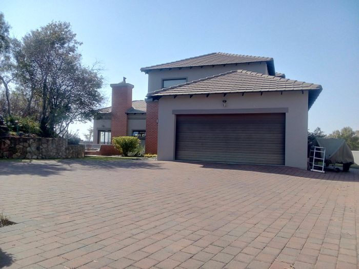 For Sale: Spacious Monavoni house with pool, solar system, and green belt views.