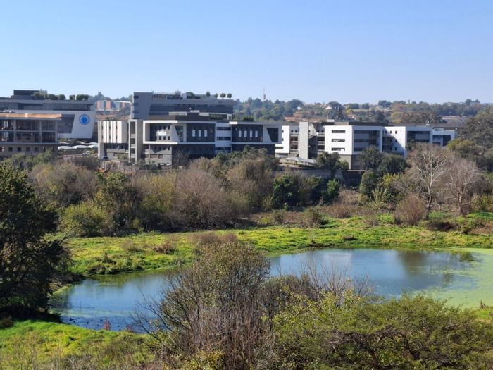 For Sale: Apartment in Zwartkop with lake views, balcony, and garage.