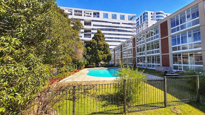 For Sale: Sandown Apartment with garden views, pool, and secure parking.