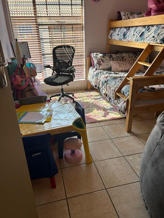 4-Bedroom Townhouse in Montana Tuine To Rent, features garage, garden, and security.