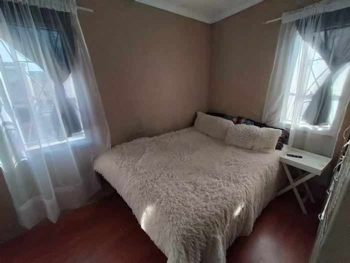 For Sale: House in Woodlands with spacious yard, security, and central amenities.