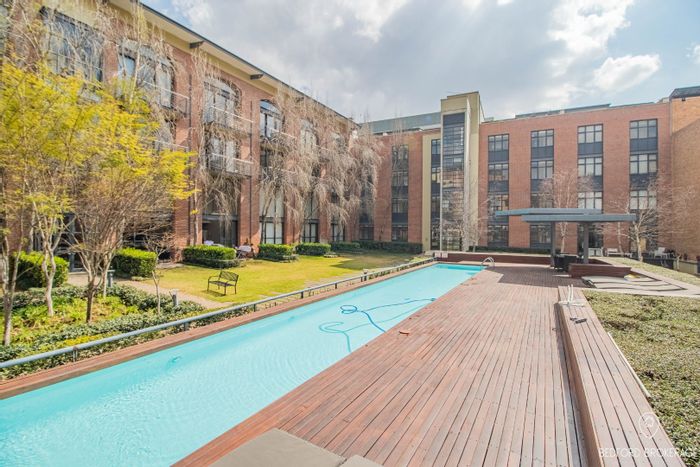 2-Bedroom Apartment To Rent in Melrose Arch with pool, security, and parking.