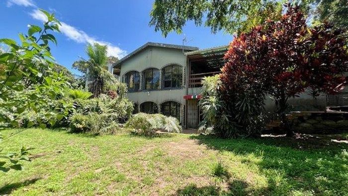 Uvongo House For Sale: 3 beds, 2.5 baths, flatlets, garages, income potential.