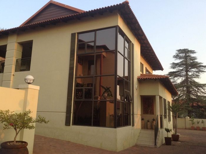 For Sale: House in Wilkoppies with 3 beds, 4 garages, and dual patios.