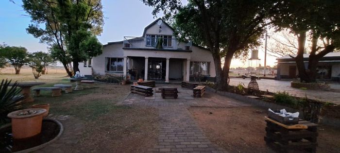 Klerksdorp Rural Farm For Sale: Income-generating stables, boreholes, and housing included.