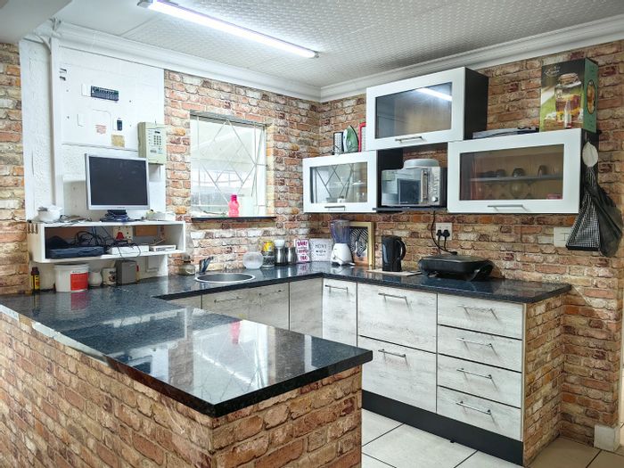 For Sale: Spacious 4-bedroom house in Westridge with garage and built-in braai.
