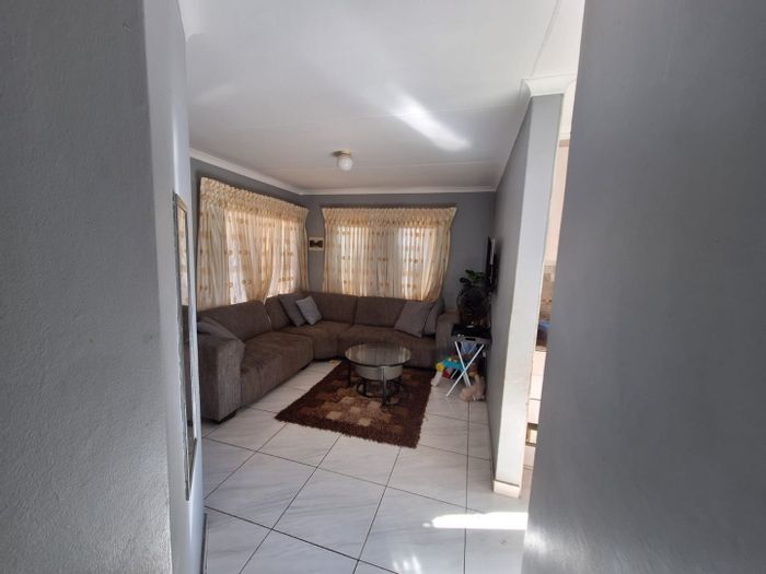 For Sale: 2-Bedroom House in Atteridgeville with secure parking and spacious living area.