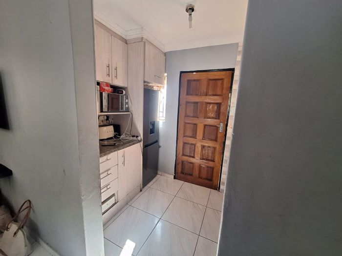 For Sale: 2-Bedroom House in Atteridgeville with secure parking and spacious living area.