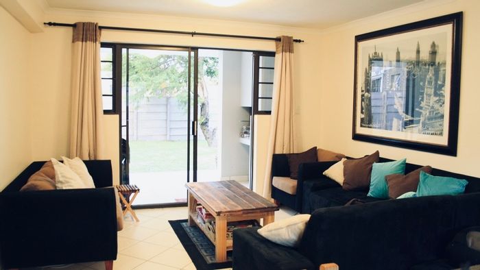 Hartenbos Central Apartment For Sale: Secure living, braai area, rental potential.