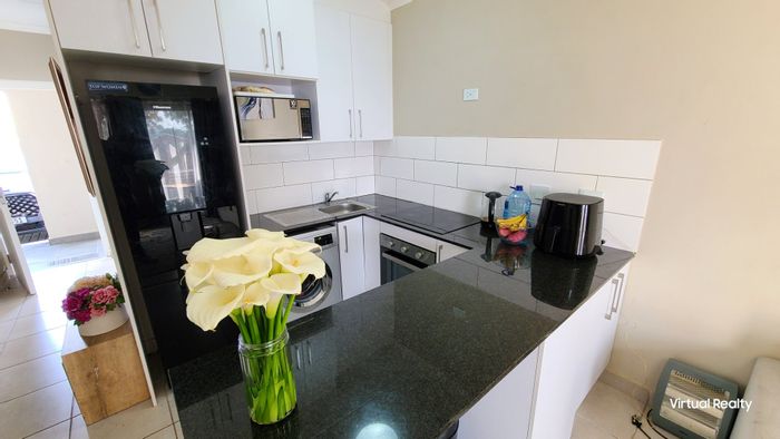 For Sale: 2-Bedroom Apartment in Oakglen with Security and Backyard Access.