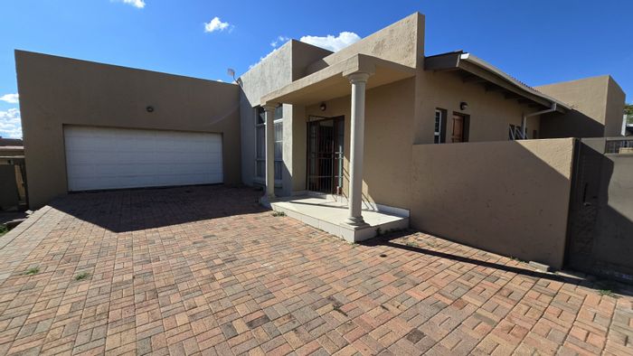 For Sale: Wilkoppies Townhouse with 3 bedrooms, double garage, and built-in braai.