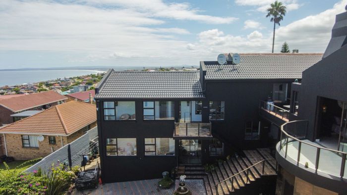 For Sale: Spacious Dana Bay house with 10 bedrooms, flats, and ocean views.