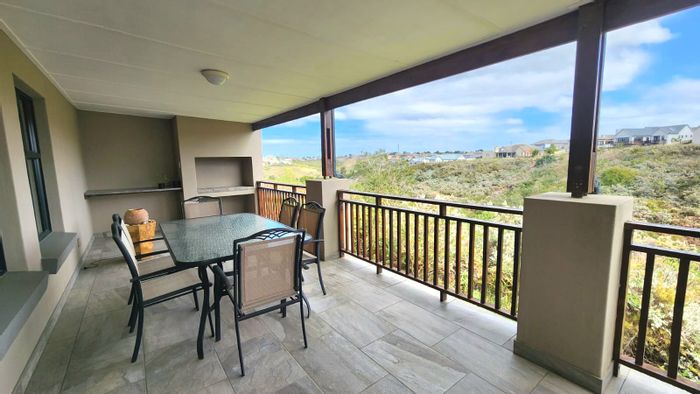 House for Sale in Blue Mountain Village: Open plan living, covered patio, versatile utility room.