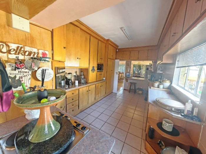 For Sale: Spacious Noordhoek House with garden, office, and income potential.