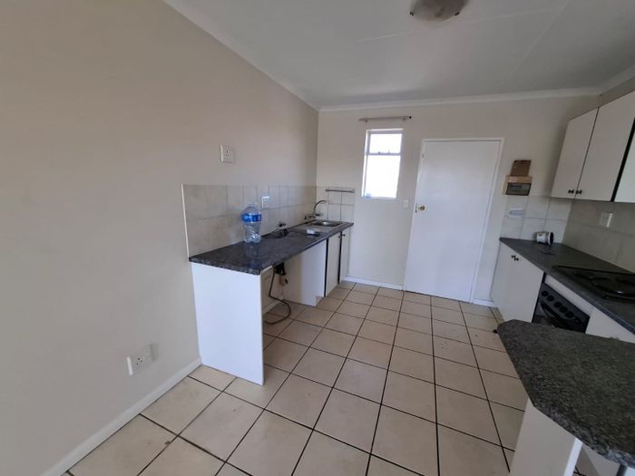 2 Bedroom Apartment For Sale in Zwartkop with lake views and secure garage.