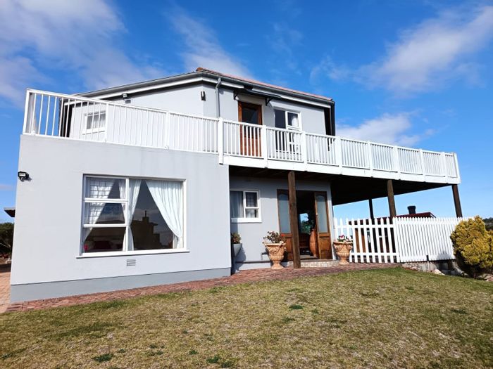 Dual-living house for sale in Cola Beach with pool, sea views, and income potential.