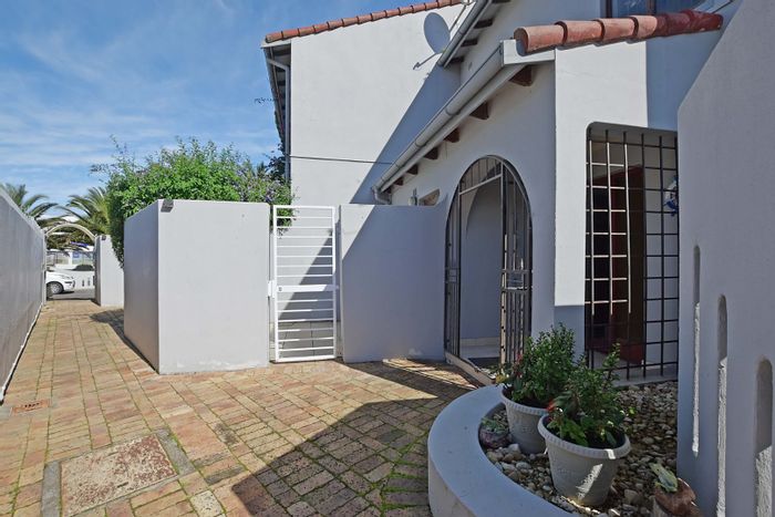 Spacious 3-bedroom apartment with garden, pool, and secure complex in Table View. For Sale.