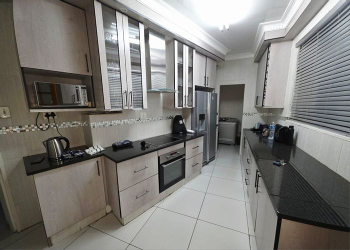 For Sale: House in Stilfontein Ext 1 with 3 bedrooms, garage, and security features.