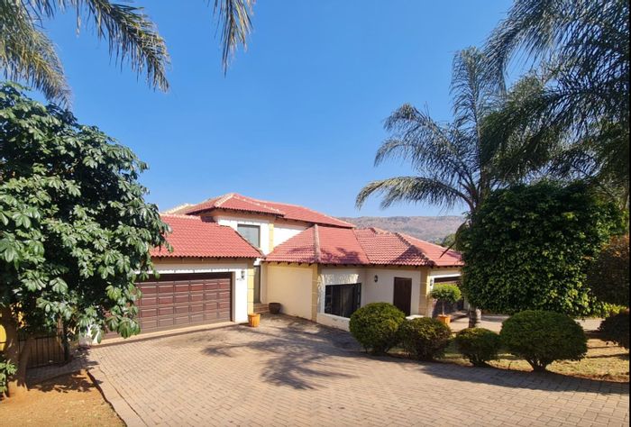 4-Bedroom House For Sale in Ruimsig Country Estate with pool and entertainment spaces.