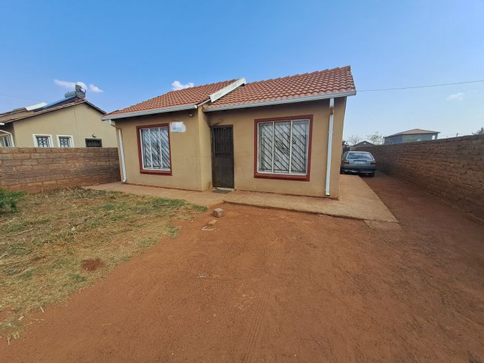 For Sale: House in Protea Glen with large yard, parking, and rental potential.