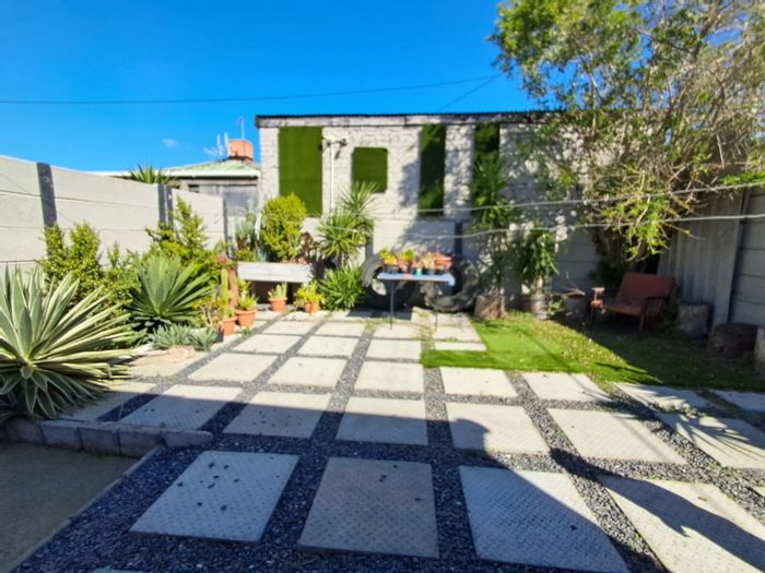 1-Bedroom Apartment To Rent in Matroosfontein with shared garden and parking.